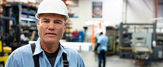 Worker in a white helmet