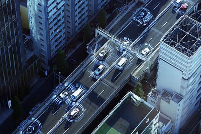 A rendering of a safe road, depicing smart card communicating with each other in an urban roadway setting.